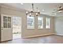 Bright dining room with hardwood floors and access to backyard at 709 Trevett Way, Marietta, GA 30062