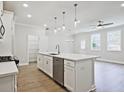 Modern kitchen with white cabinets and large island at 709 Trevett Way, Marietta, GA 30062