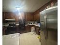 Kitchen with stainless steel appliances and wood cabinets at 5710 Stewart Mill Rd, Douglasville, GA 30135