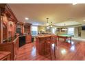 Basement bar area with custom bar and a pool table for entertaining at 5323 Lakesprings Dr, Dunwoody, GA 30338