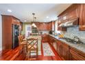 Gourmet kitchen featuring granite countertops, stainless steel appliances, and ample cabinet space at 5323 Lakesprings Dr, Dunwoody, GA 30338