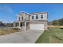 Two-story brick home with a gray front door and attached garage at 249 Chiswick Loop, Stockbridge, GA 30281