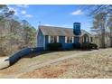 Blue house with white trim, and a large yard at 446 Mcgukin Rd, Bremen, GA 30110