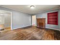 Living room with hardwood floors, fireplace and built-in shelves at 12205 Highway 36, Covington, GA 30014
