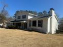 White brick home with bay windows and a spacious lawn at 1902 E Piedmont Rd, Marietta, GA 30062