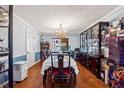 Formal dining room with hardwood floors and chandelier at 24 Planters Sw Dr, Lilburn, GA 30047