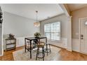 Cozy dining area with stylish light fixture and wainscoting detail at 221 Kenninghall Se Ln, Smyrna, GA 30082