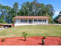 Charming ranch home with a spacious yard, freshly painted exterior and updated landscaping at 2815 Spain Dr, East Point, GA 30344