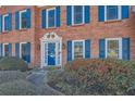 Inviting front entrance with a blue door and brick facade at 3422 Sweetbriar Ln, Powder Springs, GA 30127