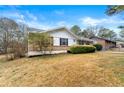 Side view of ranch house, showcasing lawn at 64 Valley Hill Sw Rd, Riverdale, GA 30274