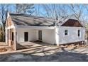 Detached garage with carport and brick accents at 26 Buena Vista Se Cir, Cartersville, GA 30121