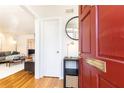 Inviting foyer with hardwood floors and a glimpse into the stylish living room at 15 Kings Tavern Nw Pl, Atlanta, GA 30318