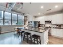 Stylish kitchen features a granite-topped island, stainless steel appliances, and subway tile backsplash at 33 Ponce De Leon Ne Ave # 203, Atlanta, GA 30308