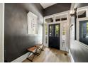Elegant entryway featuring high ceilings, light hardwood floors, and a decorative mirror at 66 Howell Ne St, Atlanta, GA 30312