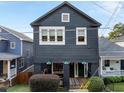 Front view of a charming two-story house with a dark gray exterior at 66 Howell Ne St, Atlanta, GA 30312