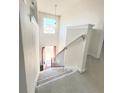 Interior view of carpeted staircase leading to upper level at 6921 Foxmoor Way, Douglasville, GA 30134