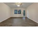 Spacious living room with hardwood floors and large windows at 170 Eldorado Dr, Carrollton, GA 30116