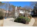 House exterior showcasing a driveway and landscaping at 3035 Saint Andrews Dr, Duluth, GA 30096