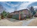 Backyard exterior showcasing brick architecture, a wooden fence, and a green landscape at 3103 Colonial Way # A, Chamblee, GA 30341