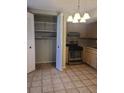 Cozy kitchen with stainless steel appliances, neutral countertops, tile flooring, and ample cabinet space at 5581 Marbut Rd, Lithonia, GA 30058