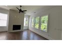 Living room with hardwood floors, fireplace and large windows at 1544 Wicker Wood Se Pl, Smyrna, GA 30080