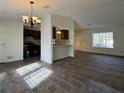 The living room flows into the kitchen with modern appliances and lots of natural light at 1173 Brockdell Ct, Norcross, GA 30093