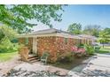 Side view of a brick home with a wooden deck and lush greenery at 3710 Lynn Dr # A & B, Powder Springs, GA 30127