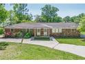 Charming brick home with a cozy front porch and manicured landscaping at 3710 Lynn Dr # A & B, Powder Springs, GA 30127
