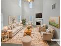 Spacious living room with high ceilings, fireplace, and neutral decor at 7085 Magnolia Ln, Fairburn, GA 30213