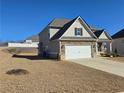 Two story house with stone accents and a two car garage at 1455 Weeping Tree Cir, Auburn, GA 30011