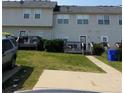 Townhouse backyard featuring a wooden deck and lawn at 125 Odyssey Turn, Conyers, GA 30012