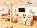 Cozy living room featuring stylish decor, wood floors, and a large flat-screen TV, perfect for relaxation at 94 Moury Se Ave, Atlanta, GA 30315