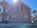 Brick facade of a two-story house with multiple windows at 1835 Freeman Road, Jonesboro, GA 30236