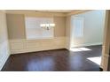 Dining room featuring dark wood floors, wainscoting, and a chandelier at 2536 Dayview Ln, Atlanta, GA 30331