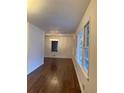 Bright dining room with hardwood floors and a modern light fixture at 2773 Fairlane Dr, Atlanta, GA 30354