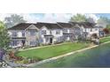 Beautiful exterior view of townhomes with lush landscaping and symmetrical facades creating curb appeal at 405 Nettle Ct, Woodstock, GA 30188