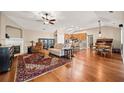 Spacious living room featuring hardwood floors, a fireplace, and an open floor plan at 320 Jessica Way, Canton, GA 30114