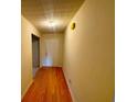 View of the hallway with hard wood flooring at 4547 Carriage Park Dr, Lithonia, GA 30038