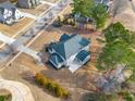 An aerial view showing the house's backyard, landscaping, and neighborhood at 5269 Heron Bay Blvd, Locust Grove, GA 30248