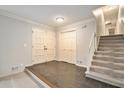 Bright entryway with tiled floor, double doors, and staircase leading upstairs at 1519 Carnaby Ct, Dunwoody, GA 30338