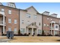 Townhome with a brick and painted exterior, two-car garage and landscaping at 1208 Stone Castle Cir # 3, Smyrna, GA 30080