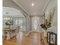 Welcoming foyer with hardwood floors and an open view to the dining room at 202 Heights Pl, Canton, GA 30114