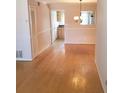 Bright dining room with hardwood floors and a chandelier at 4282 Roswell Ne Rd # G2, Atlanta, GA 30342