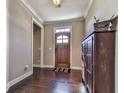 Spacious entryway with hardwood floors and a wooden door at 217 Towering Peaks, Canton, GA 30114