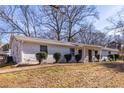 Front view of a white brick duplex with landscaping at 2698 George Nw St, Atlanta, GA 30318