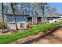 Inviting exterior of a two-story home with a well-maintained lawn and blue siding at 3732 Summitridge Dr, Atlanta, GA 30340