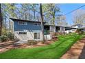 Inviting exterior of a two-story home with a well-maintained lawn at 3732 Summitridge Dr, Atlanta, GA 30340