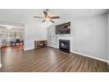 Open living area with a fireplace and laminate floors at 45 Ashbury Ct, Dallas, GA 30157