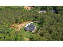 Aerial view of a house surrounded by lush greenery at 130 West Lake Blvd, Carrollton, GA 30116