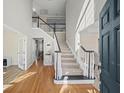 Bright foyer with hardwood floors, grand staircase, and soaring ceilings at 4130 Summit Gate Dr, Suwanee, GA 30024